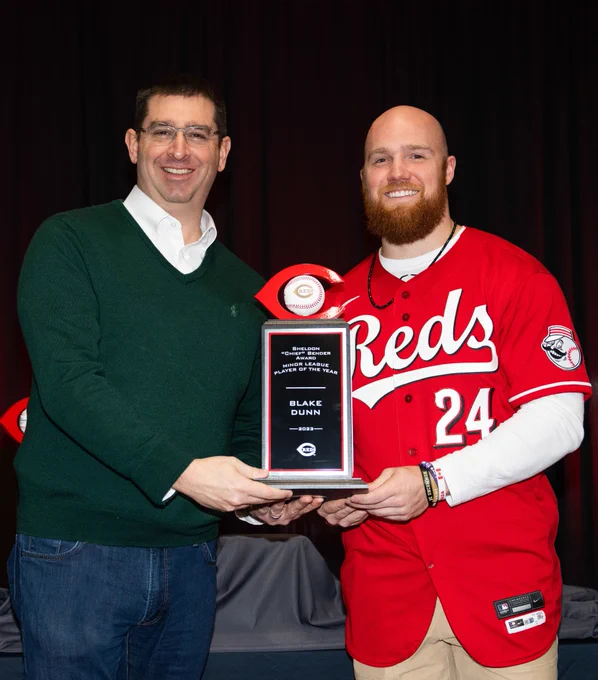 Nick Krall and Blake Dunn pose for a photo while they hold Dunn's award for Minor League Player of the Year. 