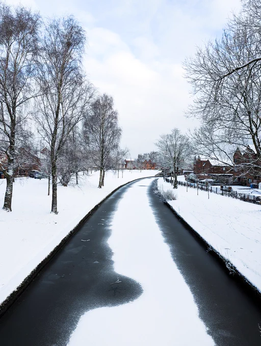 Snowy canal view in Manchester, England