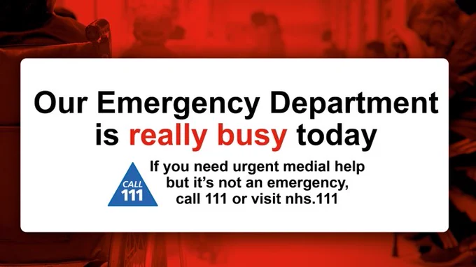 People sitting in a crowded waiting room. Text: Our Emergency Department is really busy today. If you need urgent medical help but it's not an emergency, call 111 or visit nhs 111.