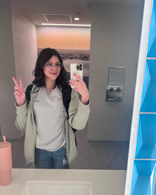 Layla smiling in an Oracle HQ bathroom.