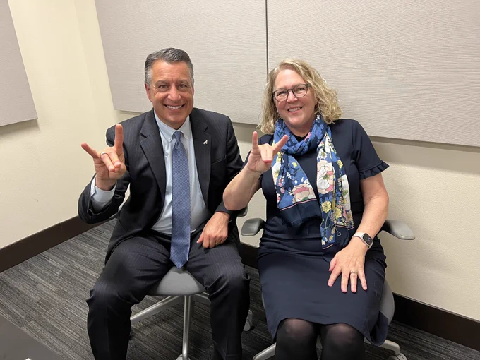Image description: University President Brian Sandoval with Catherine Cardwell, dean of the University Libraries.