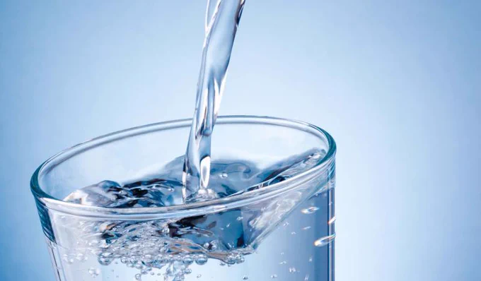 Water pouring into a glass