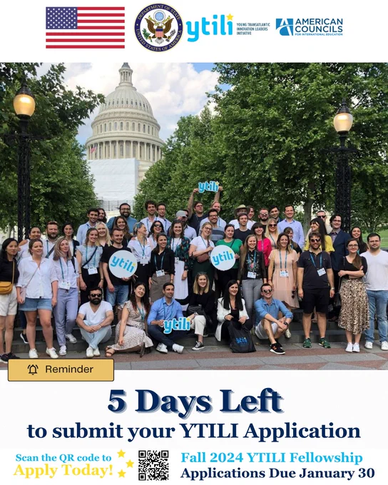 Image Description: A group of 20  fellows standing together in front of the U.S. Capitol building holding YTILI signs.