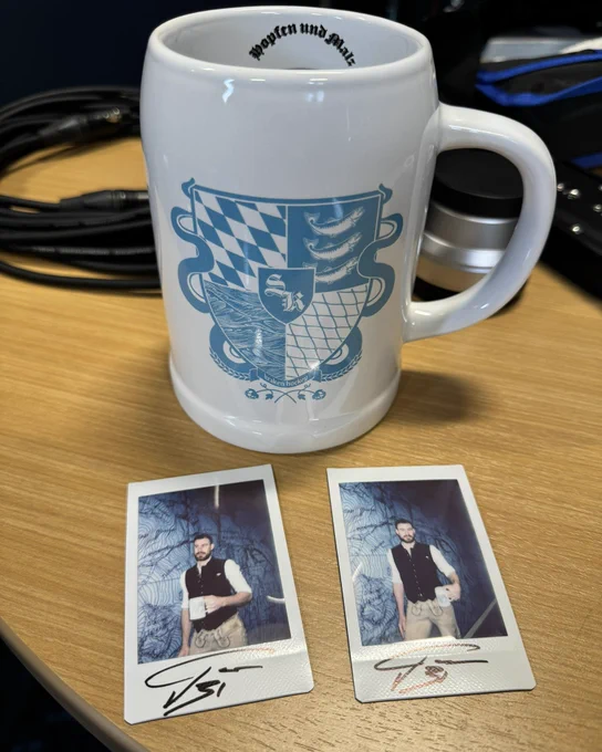 Photo of Grubi stein with two autographed Polaroids of Grubauer wearing lederhosen