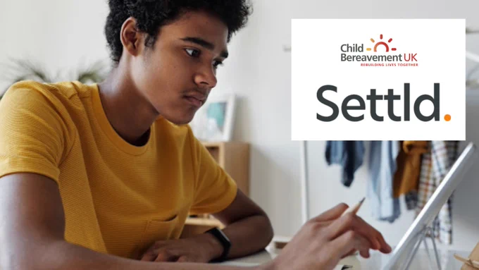 A person sitting at a desk using a touchscreen tablet on a stand with the Child Bereavement UK logo and Settld logo.
