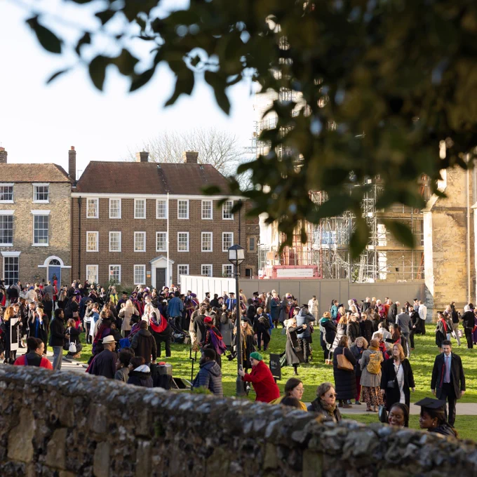 Photo outside the Cathedral with crowds of graduates and guests