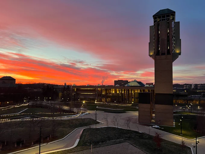 Red and orange sunrise over North Campus