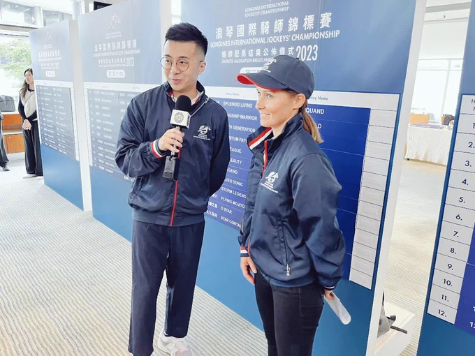 Australian jockey Rachel King dressed in her HKIR jacket as she's interviewed ahead of the International Jockeys Championship at Happy Valley. 