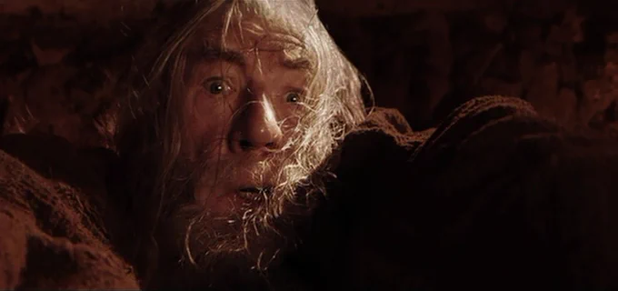 gandalf the grey about to fall into the chasm of khazad dum
