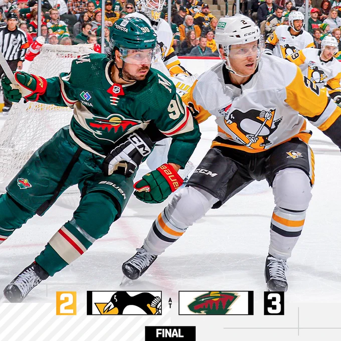 Action shot of Chad Ruhwedel vs. the Wild that shows a score of Wild 3 and Penguins 2.