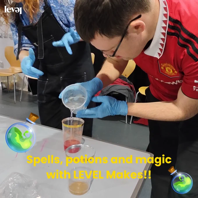 People using food colouring to create colourful potions in transparent cups. Some are pouring water into the cups and some hold them up to show the camera.
