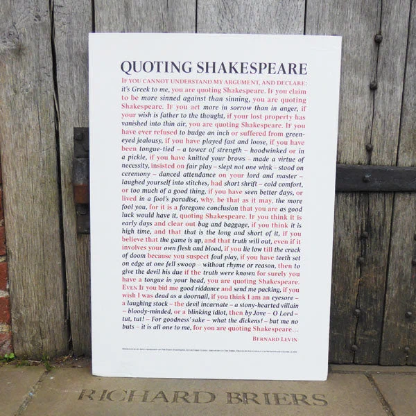 A poster, resting against a door of the Globe Theatre - with quotes from Shakespeare on it.