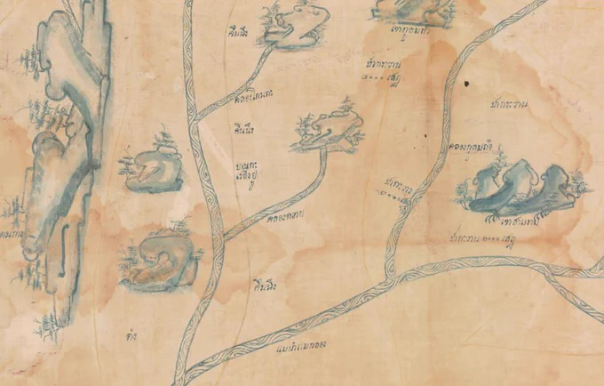 Detail of Thai cloth map in blue ink showing mountains, rivers, and text labels