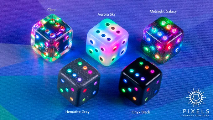 Five Pipped D6 dice, one in each colorway of Clear, Aurora Sky, Midnight Galaxy, Hematite Grey, and Onyx Black. All are lit with a different rainbow color per pip.