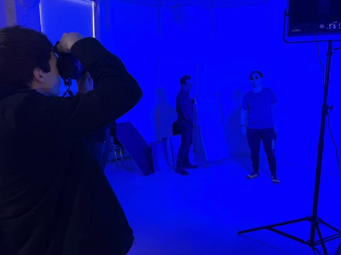Digital photo 1 students taking studio portraits.