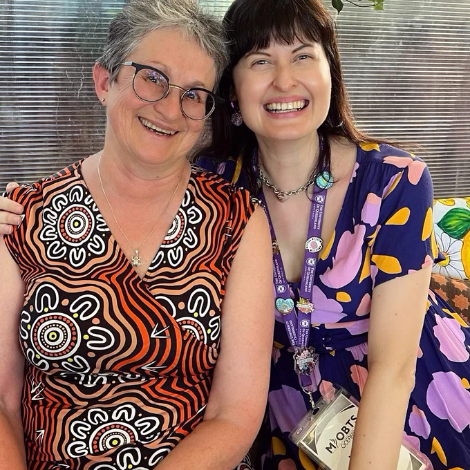 Two smiling women
