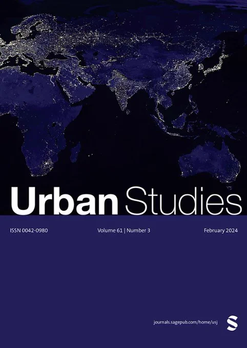 Urban Studies Journal cover. White heading text reads 'Urban Studies' and issue details are listed in fine text a banner below. Background is a map of the world at night with illuminated lights.
