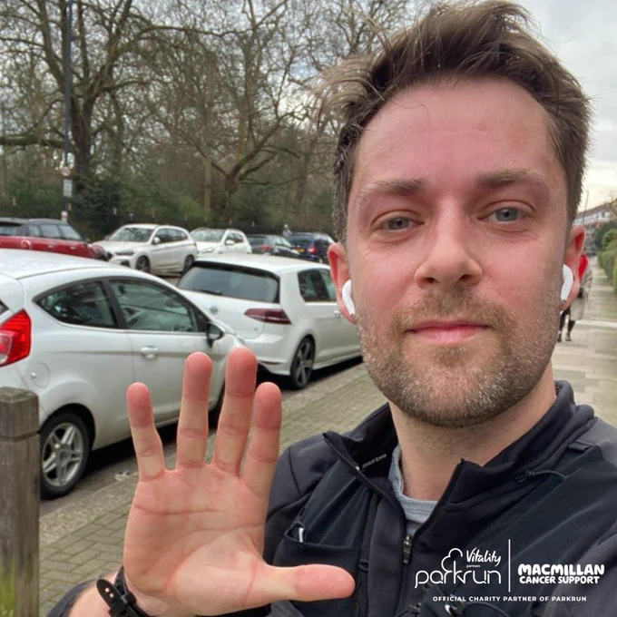 Image of man with his hand up for a high five