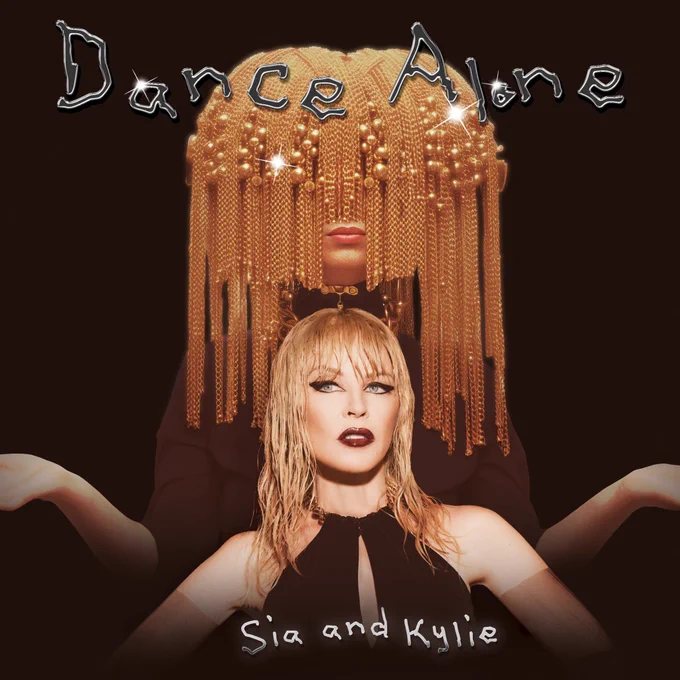 The cover of Dance Alone with Kylie Minogue sitting in front of Sia in a chain wig