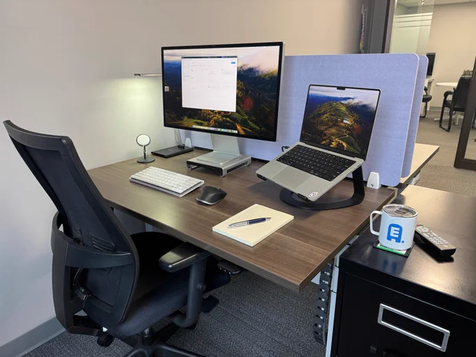 Eric's chair and desk with Macbook Pro and monitor