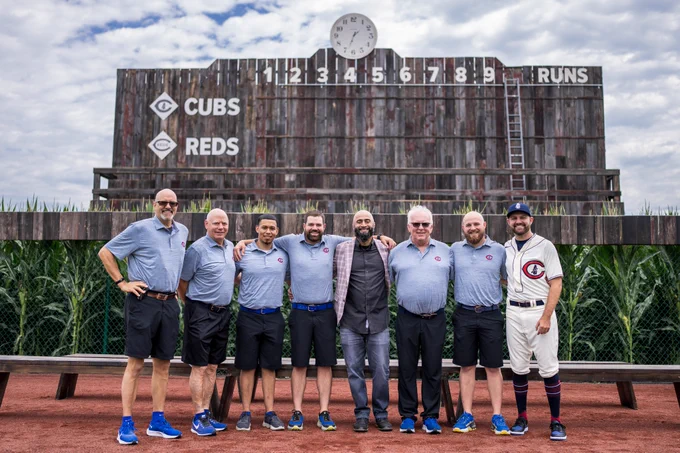 Otis stands second from the left with the current Cubs clubhouse staff at the Field of Dreams in 2022.
