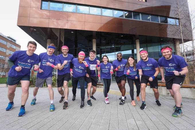 Staff in CRUK t-shirts getting ready for a run outside the SCTU offices.