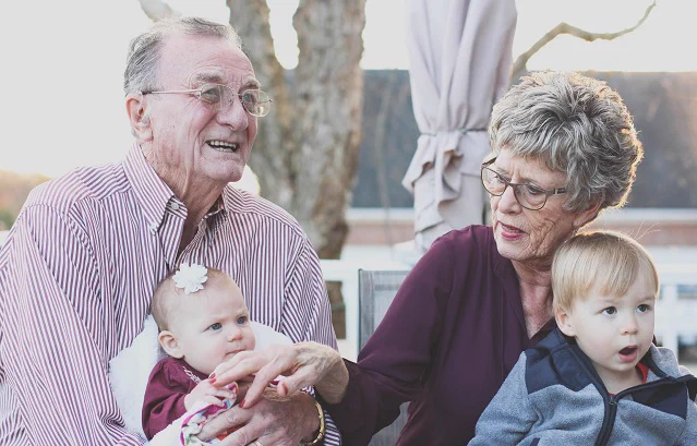 Elderly couple with their family