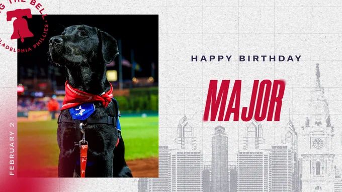 Graphic wishing Major a happy birthday. On the left is his birthday in text "February 2" and a photo of him on the field at Citizens Bank Park. On the right is text that reads "HAPPY BIRTHDAY MAJOR". The background is the skyline of Philadelphia.