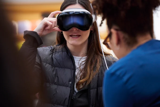 A woman demoing Apple Vision Pro.