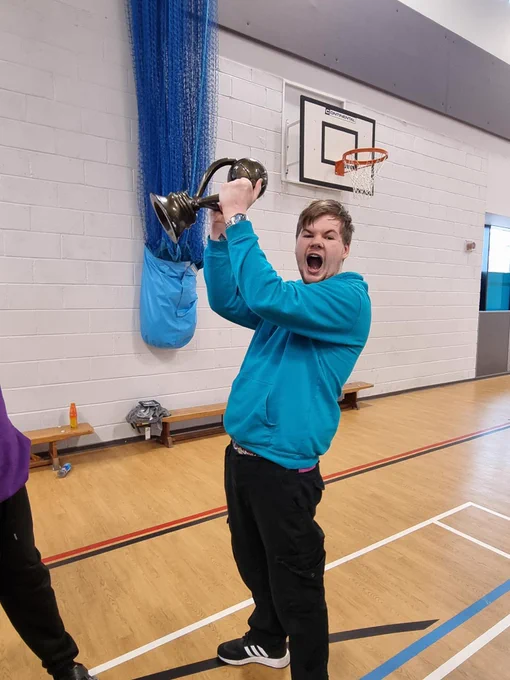 Young man holding a trophy