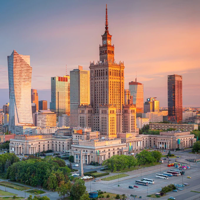 An image of the skyline of Warsaw, Poland at golden hour
