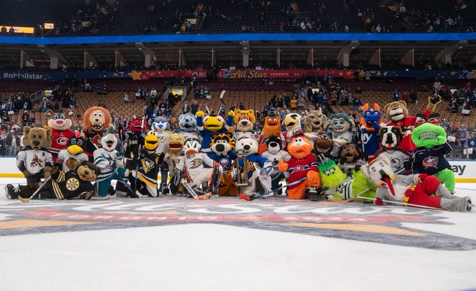 Tons of NHL Team Mascots pose for a group photo on the ice at Scotiabank Arena.