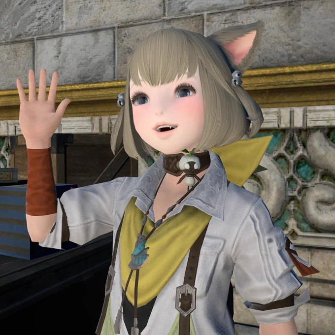 A Final Fantasy 14 screenshot of Khloe, a young female Miqo'te with short blonde hair, with her right hand held up in the air while smiling.