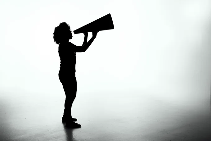 Silhouette of a woman holding a analog megaphone. Photo by Patrick Fore on Unsplash
https://unsplash.com/photos/silhouette-of-woman-holding-rectangular-board-5YU0uZh43Bk