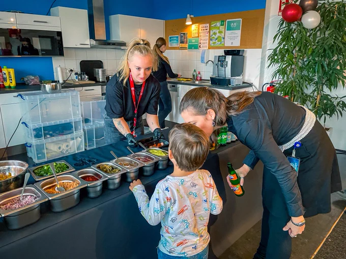 One of our little guests choosing burger toppings for the lunch option. 