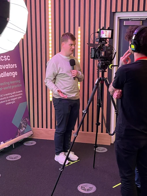 Student on the NCSC Innovators Challenge being interviewed on camera about the experience
