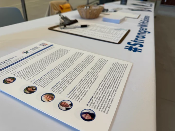 A photo of the program and check-in table.