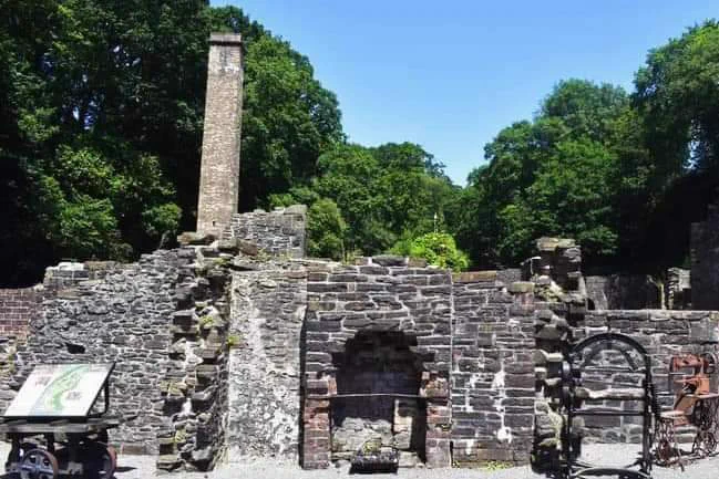 Ruins of buildings at Aberdulais tinworks on a sunny day 