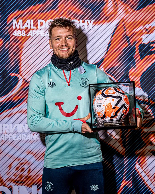 Luke Berry holding his Premier League debut ball.