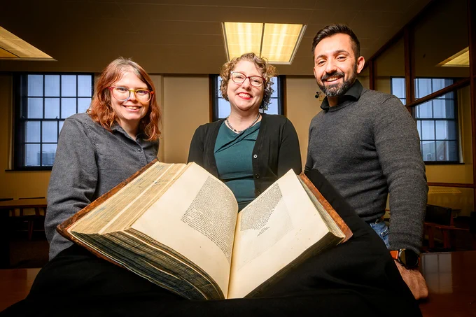 The Rare Book and Manuscript Library has acquired a first edition of Plato’s works printed in Greek in the 16th century by the famous Venetian printing house Aldine Press. RBML curator Cait Coker, RBML head Lynne M. Thomas and Elias Petrou, the librarian for classical studies, medieval studies and modern Greek studies, are pictured with the volume.

Photo by Fred Zwicky