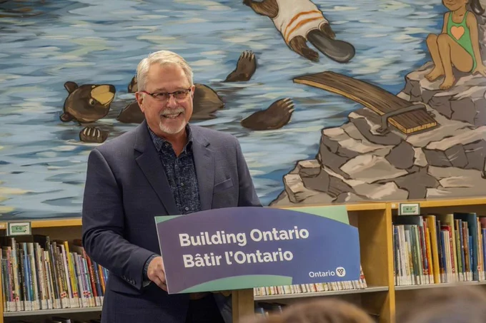 Minister Lumsden at the Gravenhurst public library.