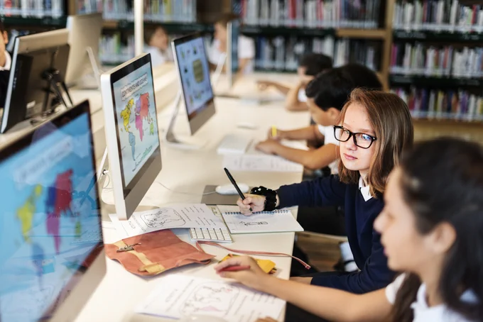 Children using computers in a public library.