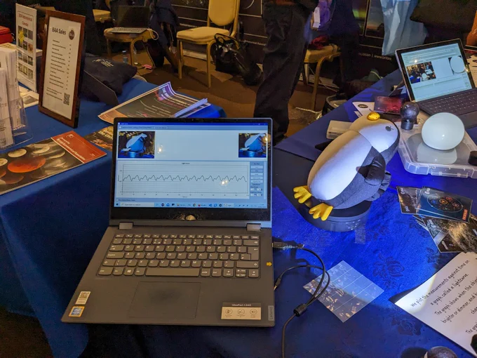 Picture of a computer screen with a graph on it and a rotating penguin (yes, really!) to demostrate how light refelcts differently off the white and black surfaces