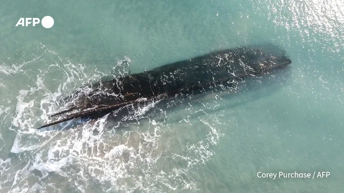 An aerial view of an old shipwreck on the shore of Cape Ray, Newfoundland and Labrador, Canada