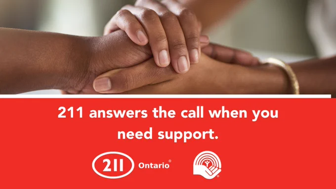 Text says: 211 answers the call when you need support.

Image description: image of two people holding hands across a table. 

