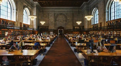Students editing and writing essays at college.
