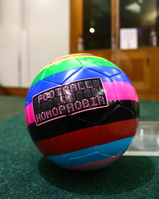 A rainbow coloured Football v Homophobia matchball