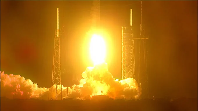 NASA's Plankton, Aerosol, Climate, ocean Ecosystem (PACE) satellite launched aboard a SpaceX Falcon 9 rocket at 1:33 a.m. EST, Feb. 8, 2024, from Space Launch Complex 40 at Cape Canaveral Space Force Station in Florida. Yellow flames erupt from the rocket's engines, illuminating the vapor, launch tower, and lightning tower. Credit: NASA