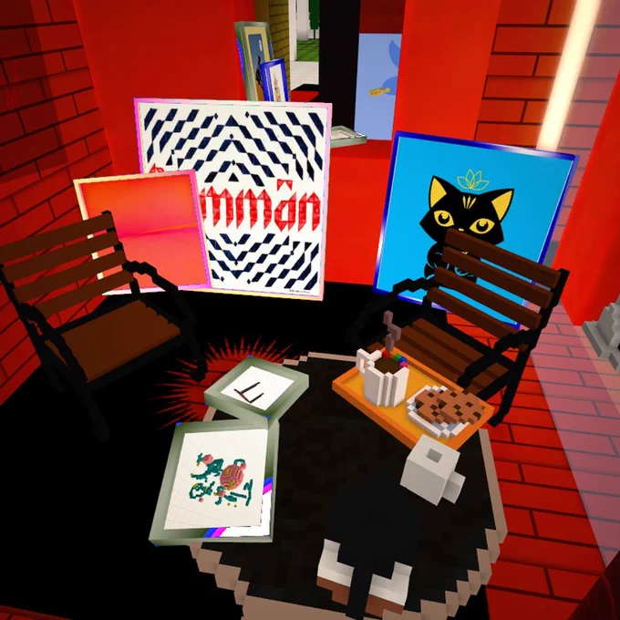 corner of a red room with two chairs and a table with coffe and cookies on it. Rare digital art is showcased in multi-colored frames on the table, ground and window. Works by @blackboxdotart, @MattiaC, @stina_jones, @lenara

