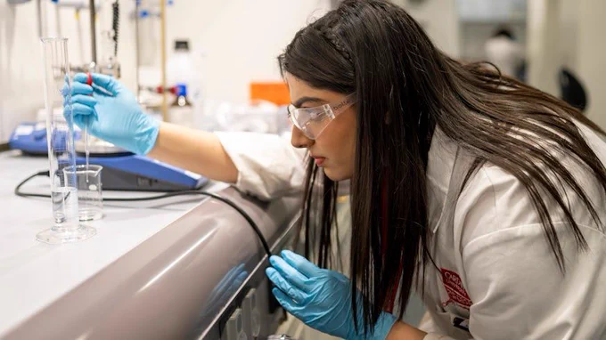 Researcher tests water in a lab